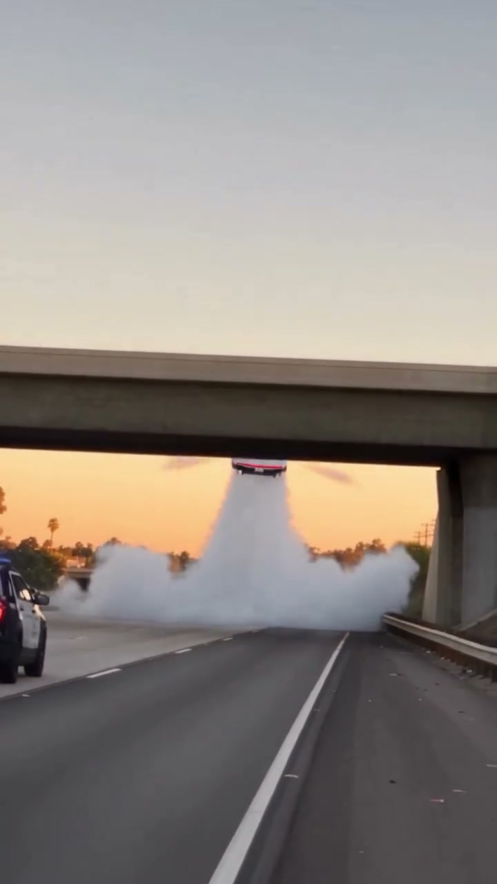 Police Escape reference: a pursued car flies over a highway chase.
